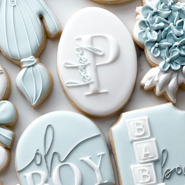 Whimsical Blue and White Elegant Sugar Cookies: A Charming Centerpiece for Celebrations.