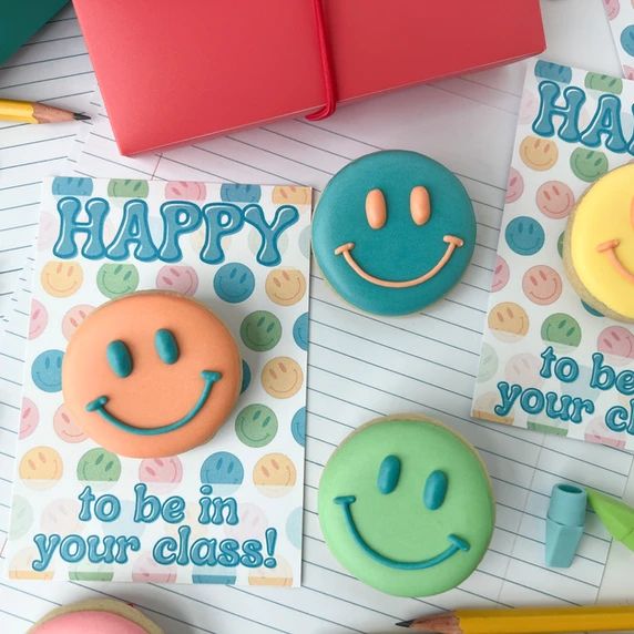 Cheerful Smiley-Face Cookies in Vibrant Colors Brighten Classroom Atmosphere.