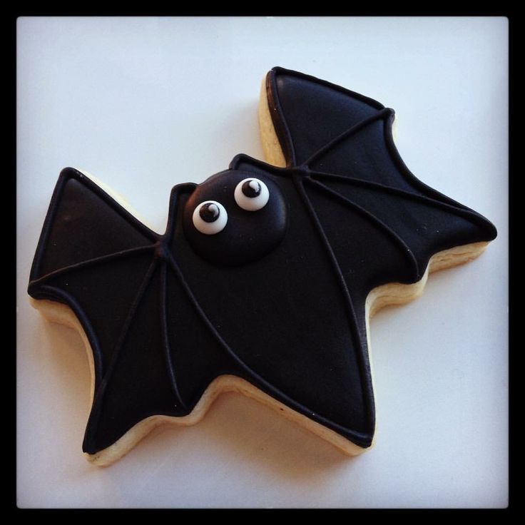 Charming Bat-Shaped Halloween Cookie with Glossy Icing and Playful Eyes