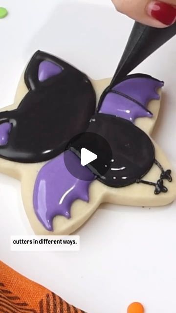 Whimsical Bat-Shaped Cookie Design with Glossy Black Icing and Vibrant Purple Wings for Festive Celebrations