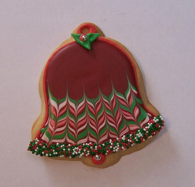 Festive Bell Cookie Design with Intricate Icing and Colorful Accents