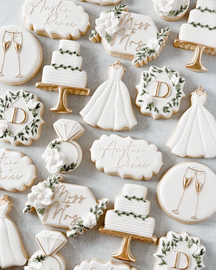 Artfully Displayed Elegant Wedding-Themed Cookies with Exquisite Designs and Soft Color Palette.