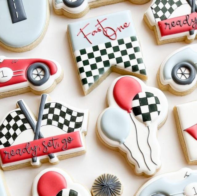 Racing-Themed Colorful Cookies: Festive Designs with Checkerboard Patterns and Playful Elements.