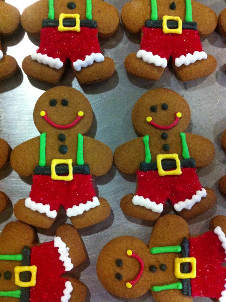 Cheerful Festive Gingerbread Cookies Dressed as Santa Delight in Holiday Spirit.