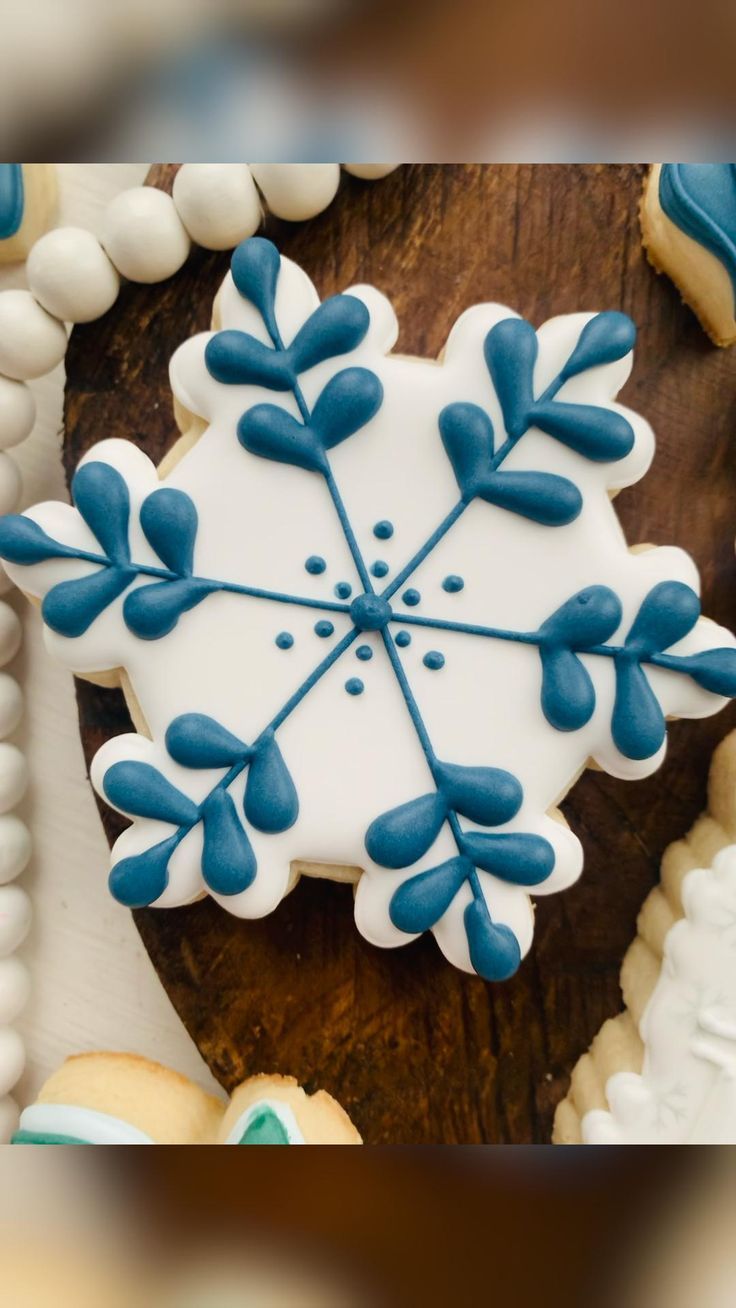 Frosty Blue Iced Snowflake Cookie Design Inspires Elegant Nail Art for Seasonal Celebrations.