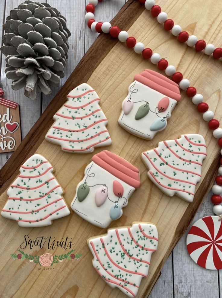 Cheerful Holiday Cookies: Festive Tree and Cup Designs in Vibrant Patterns.