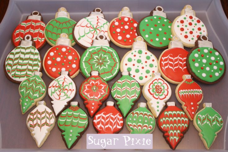 Festive Ornament-Shaped Cookies: Inspiring Creative Holiday Nail Art with Vivid Designs.