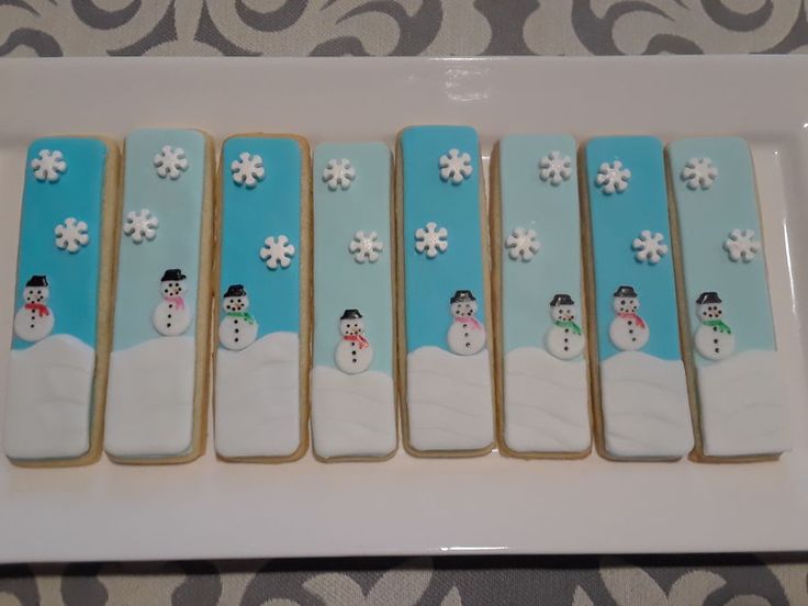 Cheerful Winter-Themed Cookies Featuring Snowmen and Snowflakes