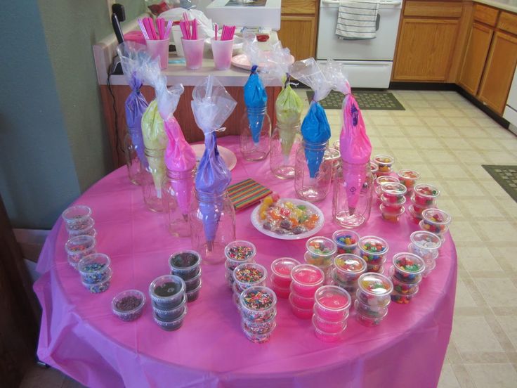 Vibrant Dessert Table with Colorful Candies and Playful Pink Touch.