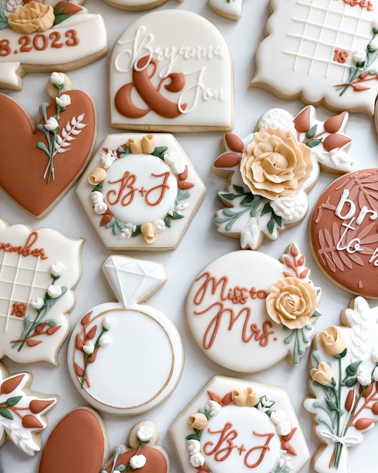 Elegant Floral-Themed Cookies: Whimsical Designs in Soft Peaches, Creams, and Greens Perfect for Celebrations.