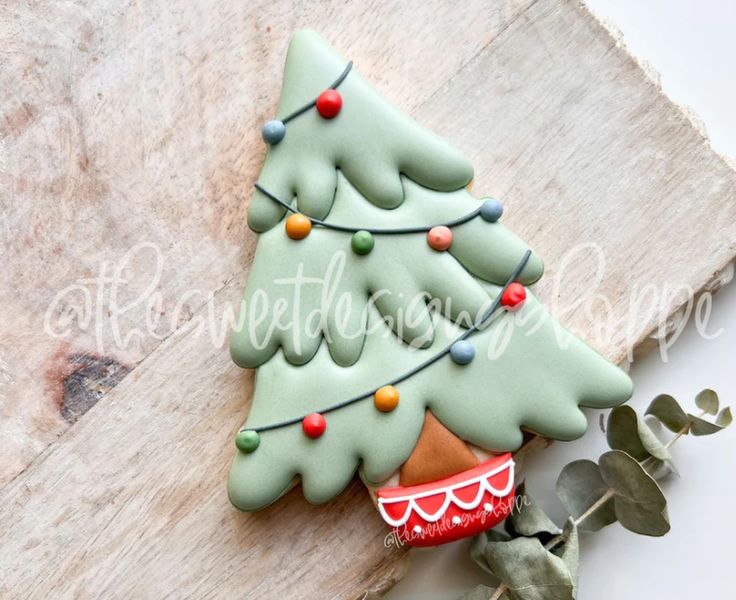 Whimsical Soft Green Christmas Tree Design with Colorful Lights