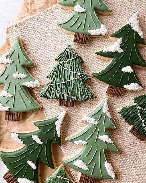 Intricately Designed Christmas Cookies with Colorful Trees and Icing Decor