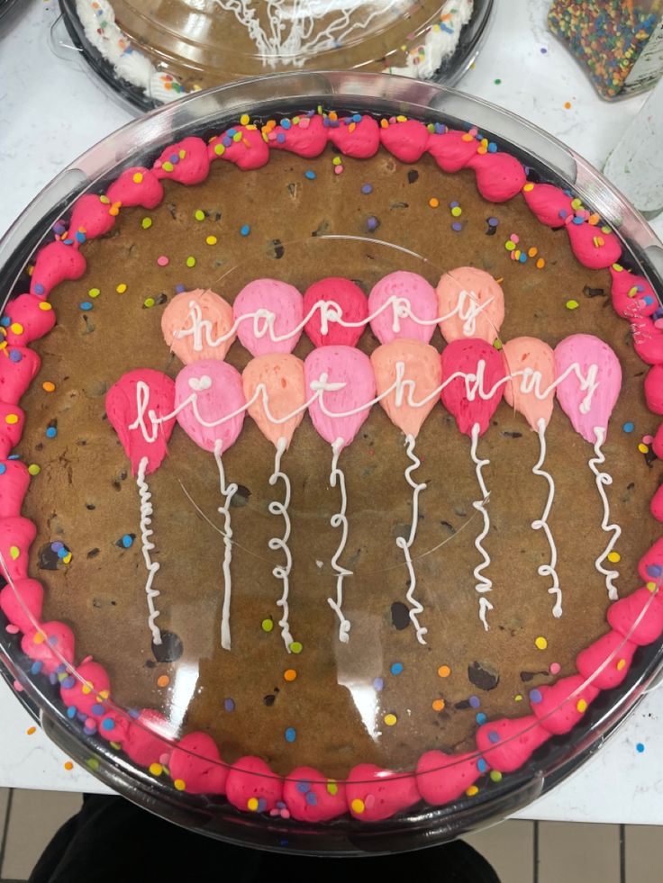 Cheerful Colorful Birthday Cookie Cake with Pink Frosting and Pastel Balloon Designs