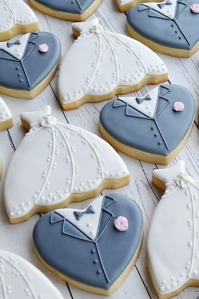 Whimsical Wedding-Themed Cookies: Heart-Shaped Delights in Bridal Dresses and Tuxedos.