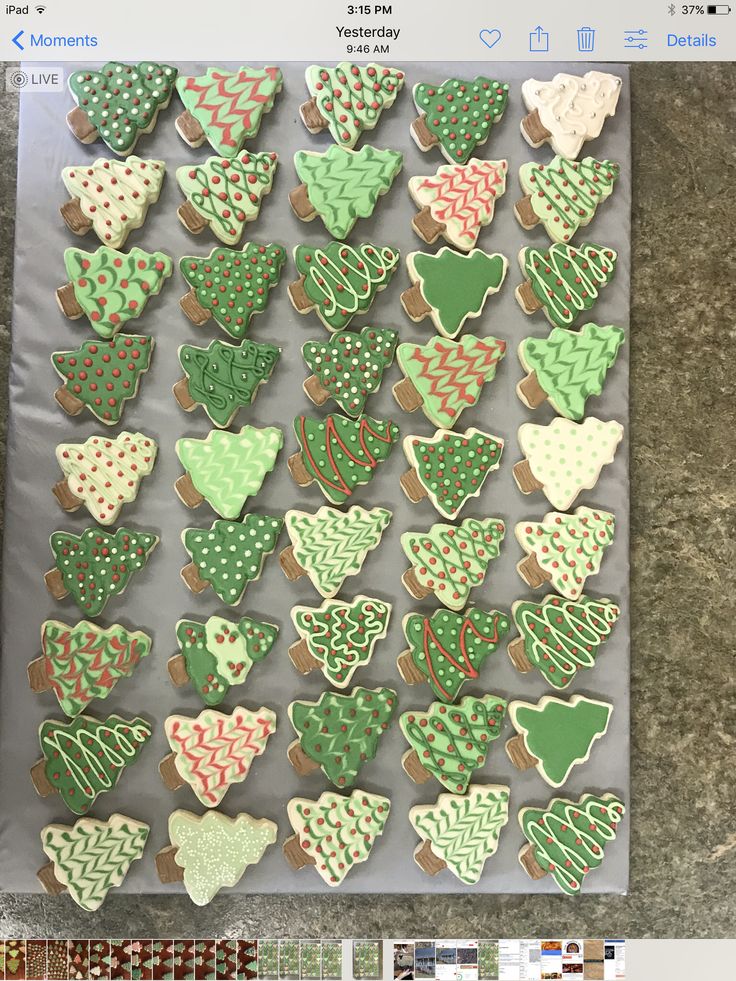 Delightful Holiday Tree-Shaped Cookies with Cheerful Icing Designs.