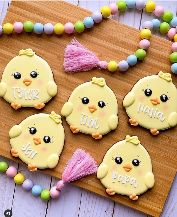 Charming Chick-Shaped Cookies with Vibrant Icing and Delightful Decorations.