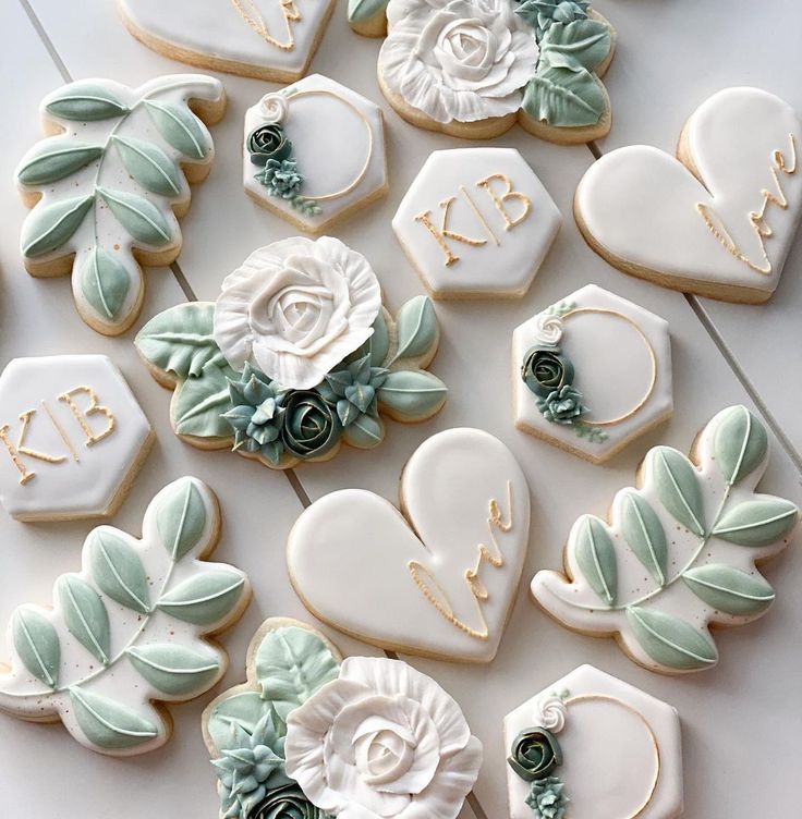 Elegant Floral-Inspired Cookie Designs in Soft Green and White for Special Occasions