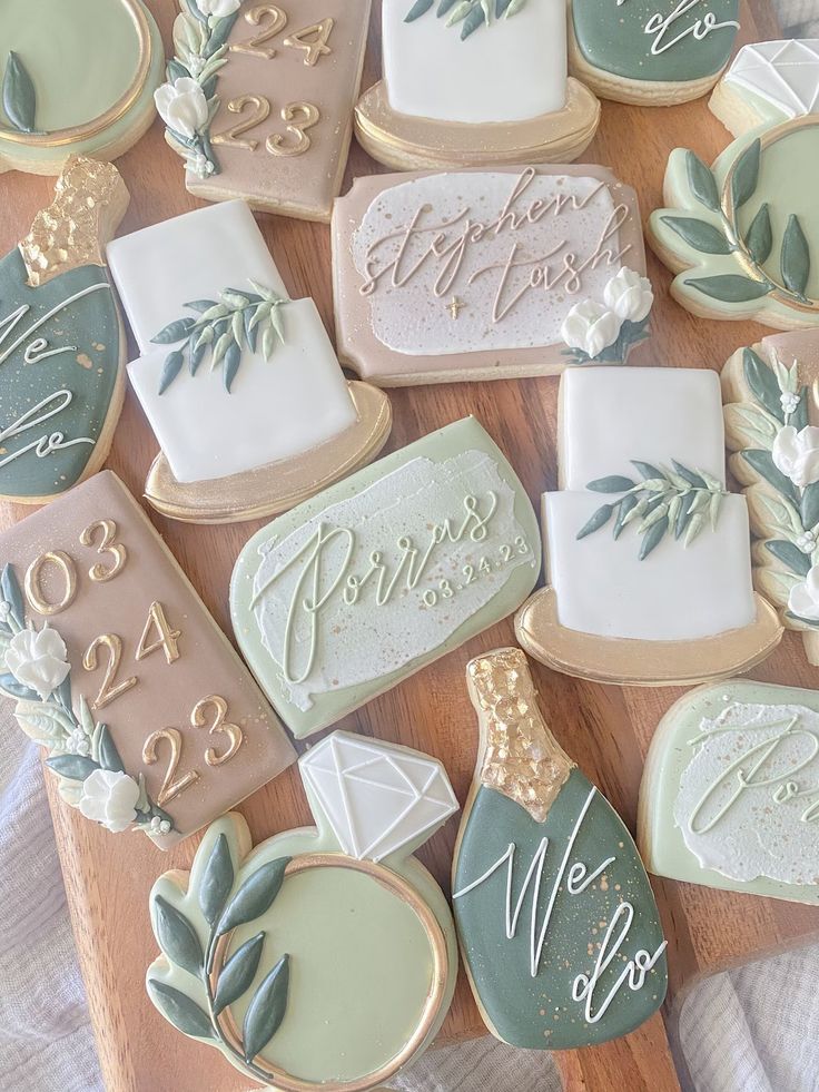 Charming Pastel Wedding Cookies Adorned with Intricate Icing and Floral Accents.