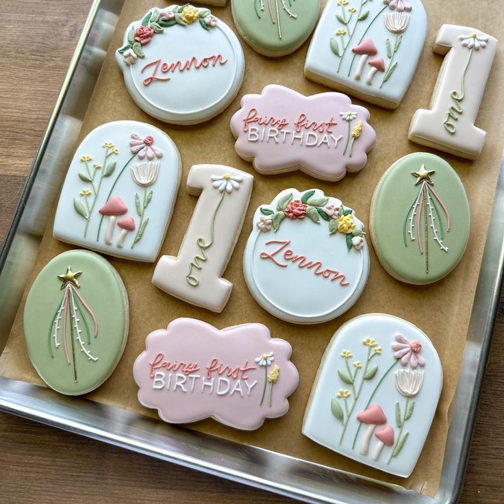 Whimsical Floral and Mushroom Cookie Designs in Soft Pastels for Charming Celebrations.