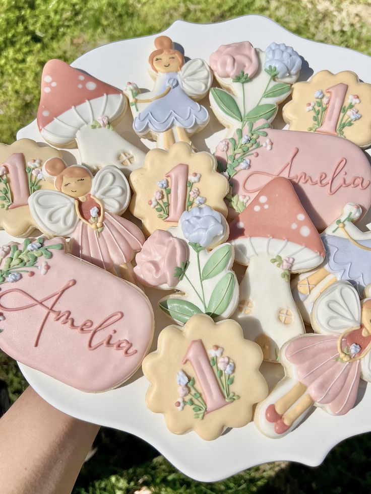 Enchanting Whimsical Cookie Platter with Fairy and Floral Designs for Celebrations.