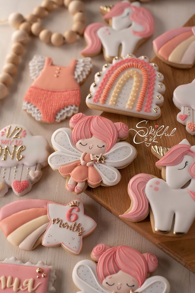 Whimsical Pastel Decorative Cookies Featuring Unicorns, Fairies, and Rainbows for Celebrations.