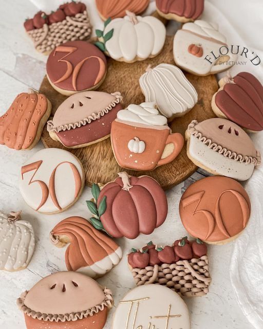 Artfully Arranged Autumn-Themed Cookies on a Wooden Platter