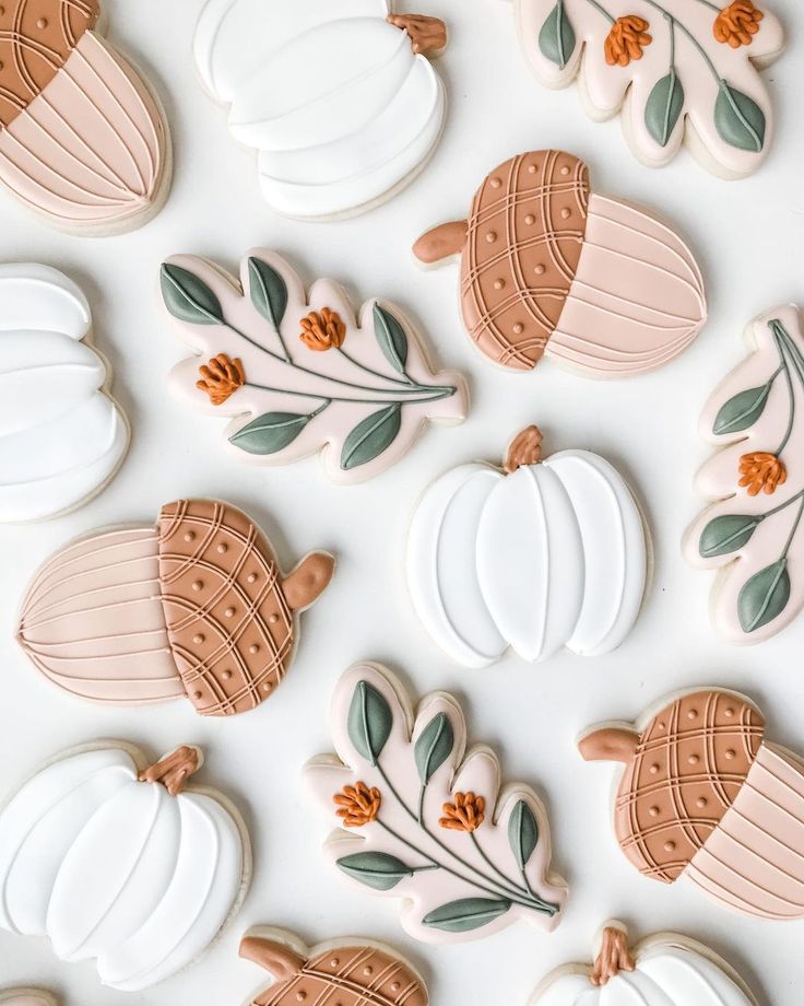 Charming Autumn-Inspired Cookies with Pumpkin and Acorn Designs in Soft Pastels.