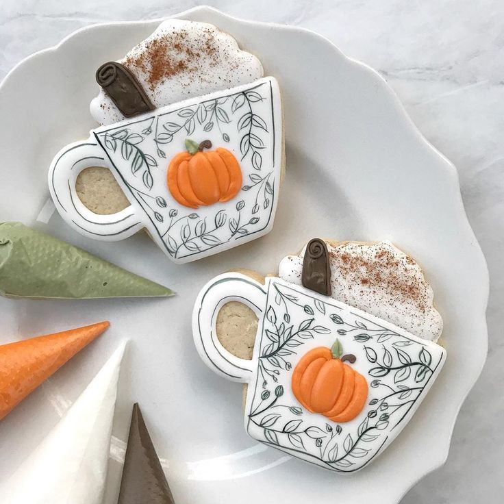 Autumn-Themed Decorative Cookies Shaped Like Pumpkin Spice Latte Mugs with Intricate Details.