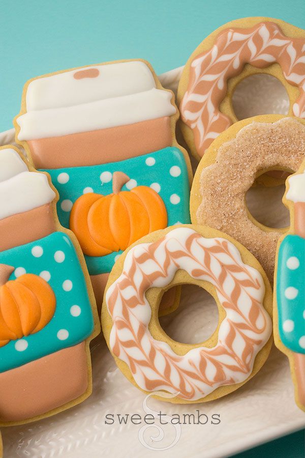 Vibrant Fall-Themed Cookie Designs: Whimsical Shapes and Festive Icing.