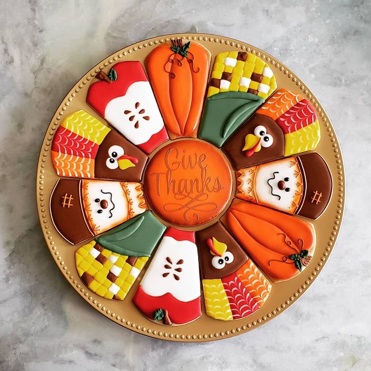 Festive Autumn Cookie Platter: Whimsical Designs in Vibrant Colors.