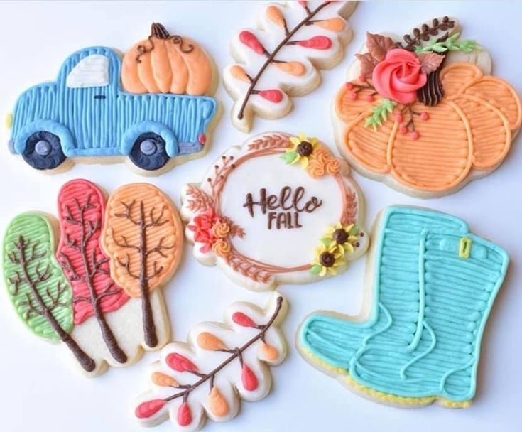 Charming Autumn Cookies Featuring a Blue Truck, Pumpkins, and Vibrant Fall Leaves.