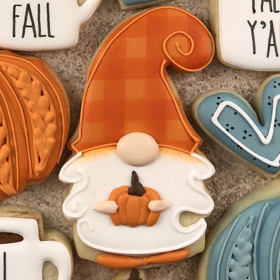 Whimsical Autumn Gnome Cookie with Vibrant Colors and Pumpkin.