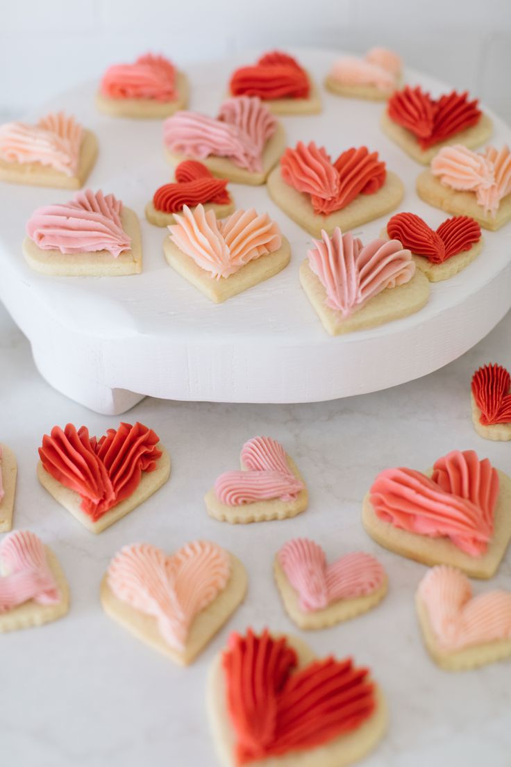 Festive Heart-Shaped Cookies with Swirled Buttercream Icing: A Romantic and Delicious Delight.