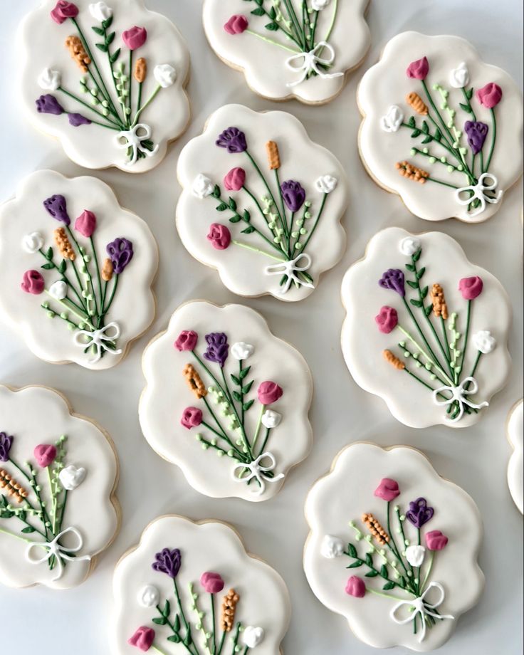 Charming Floral-Themed Cookies with Intricate Icing Designs for Celebrations.