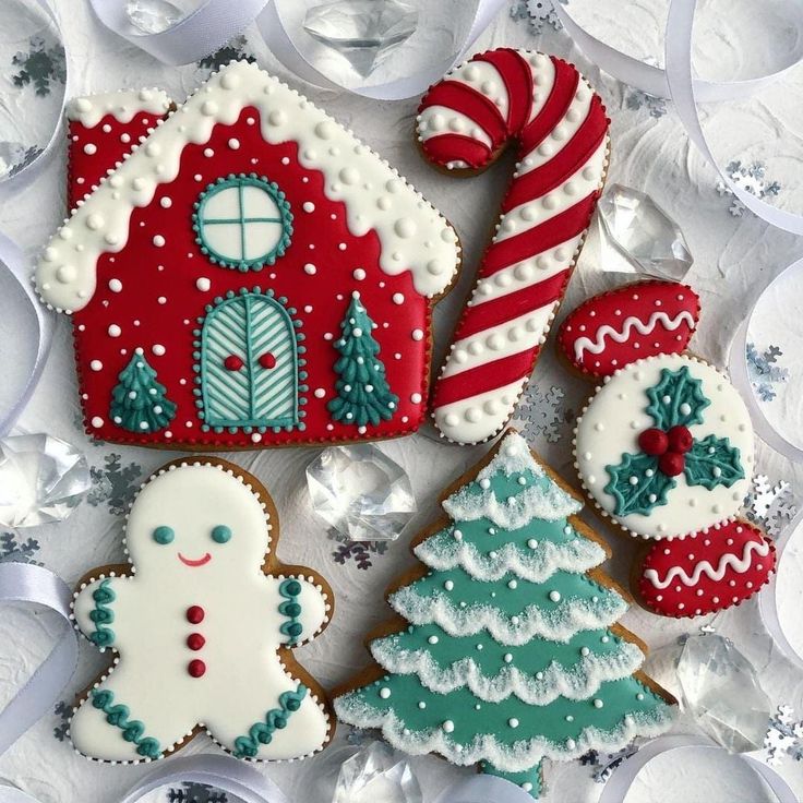 Whimsical Festive Display of Colorful Christmas Cookies and Gingerbread House.