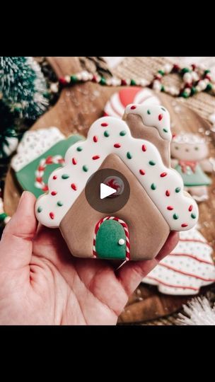 Charming Festive Cookie Design: Gingerbread House with Candy Cane Accents and Whimsical Winter Vibes