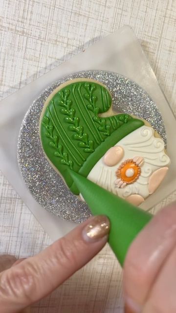 Exquisite Green Hat Cookie Decoration with Delicate Leaf Patterns in a Festive Setting