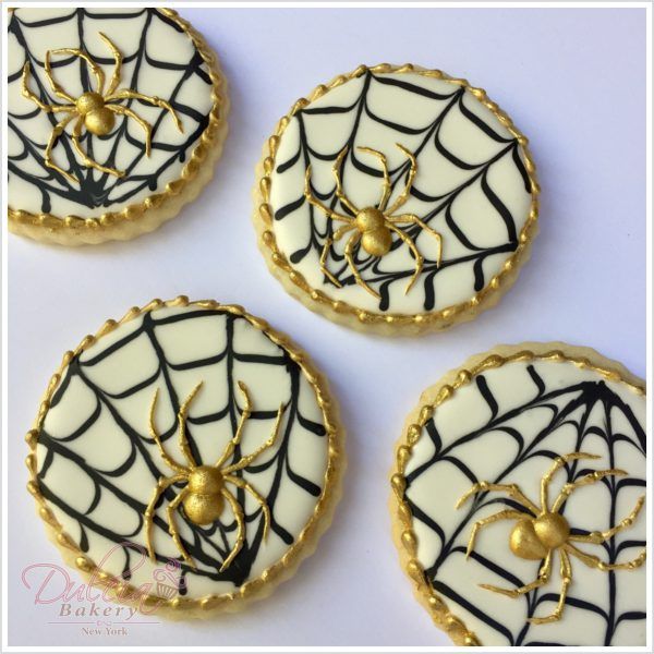 Elegant Spider Web Cookie Designs with Golden Spiders for Themed Celebrations.