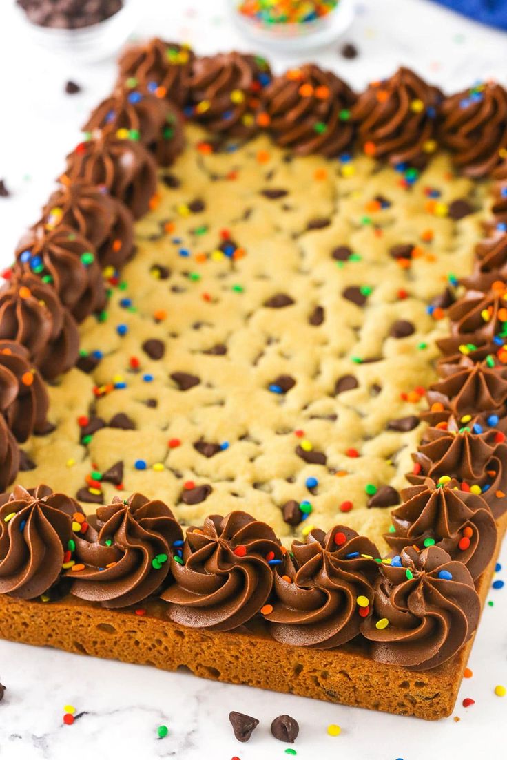 Delightful Festive Cookie Cake: Chewy Texture, Rich Frosting, and Colorful Sprinkles for Celebrations.