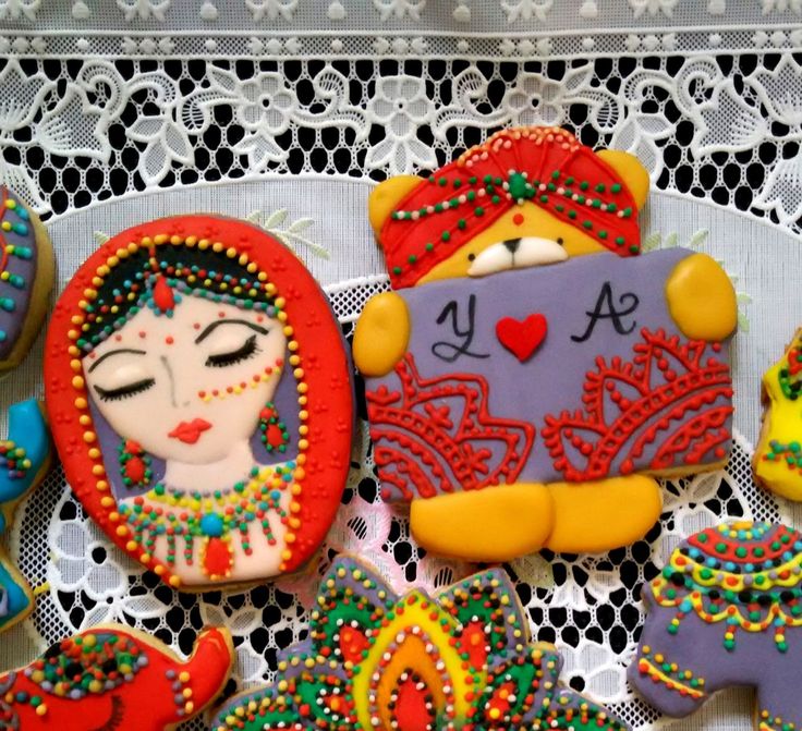 Intricate and Colorful Sugar Cookies Showcase Cultural Themes with Vibrant Icing.