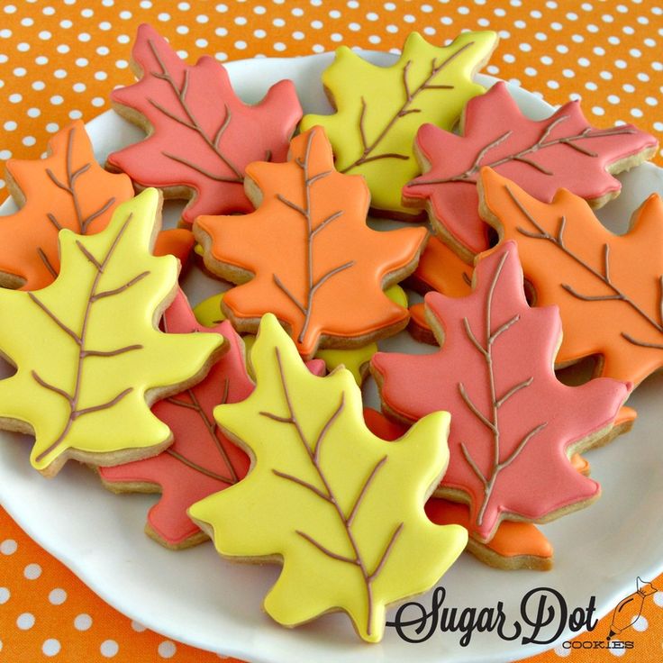 Vibrant Autumn Leaf-Shaped Cookies with Intricate Icing Designs.