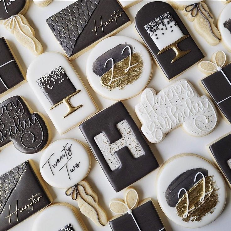 Elegant Birthday-Themed Decorative Cookies in Black, White, and Gold.