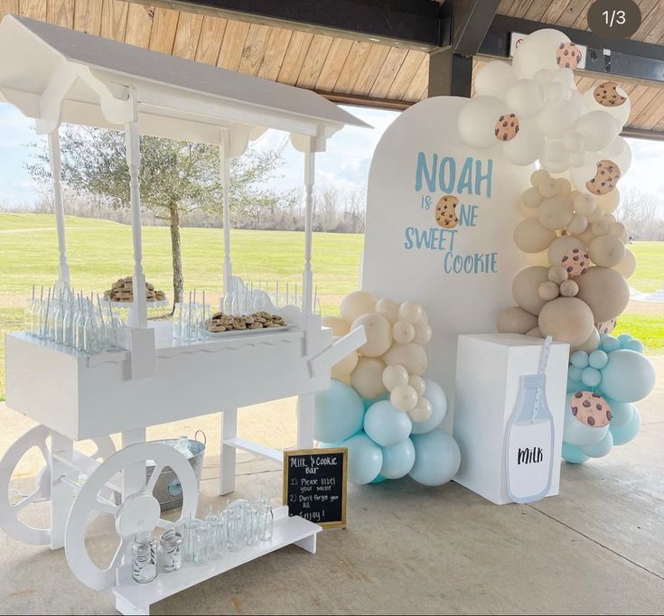 Whimsical Dessert Cart with Pastel Balloons and Inviting Treats.