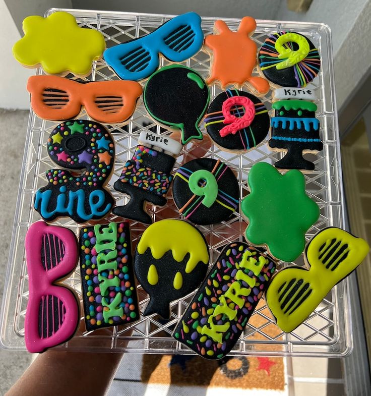 Vibrant Cookie Designs for Festive Celebrations: Playful Shapes and Neon Colors.