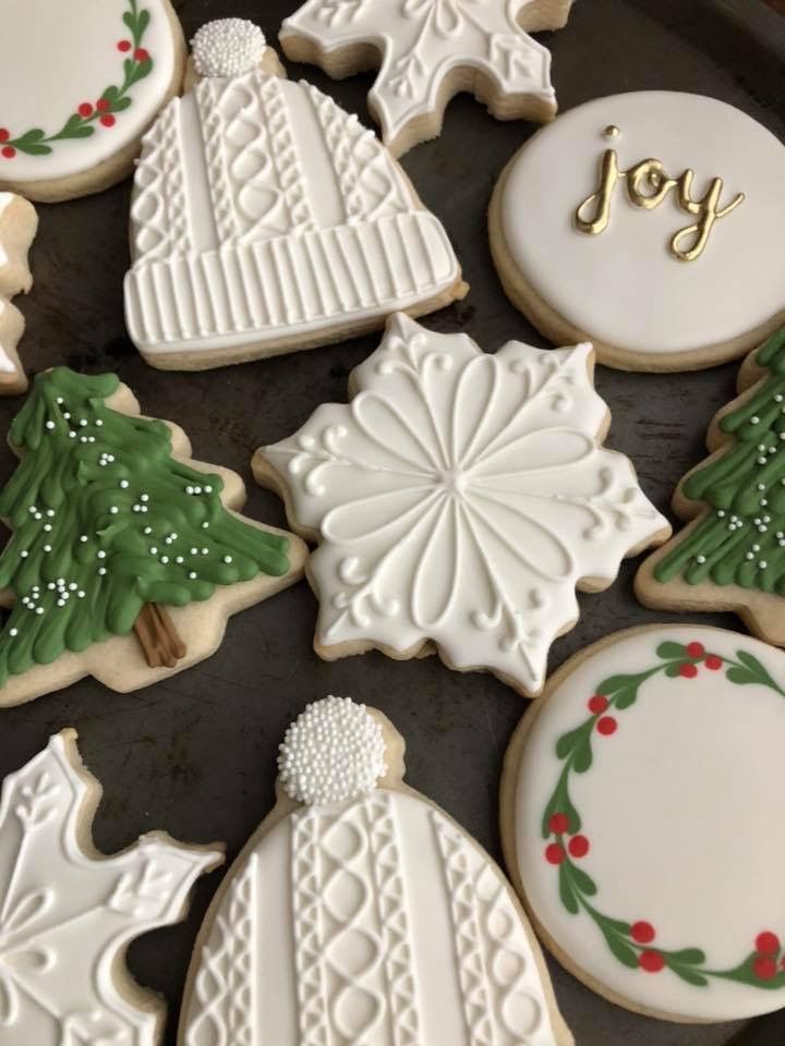 Intricate Winter-Themed Festive Cookie Designs with Cheerful Icing Accents.