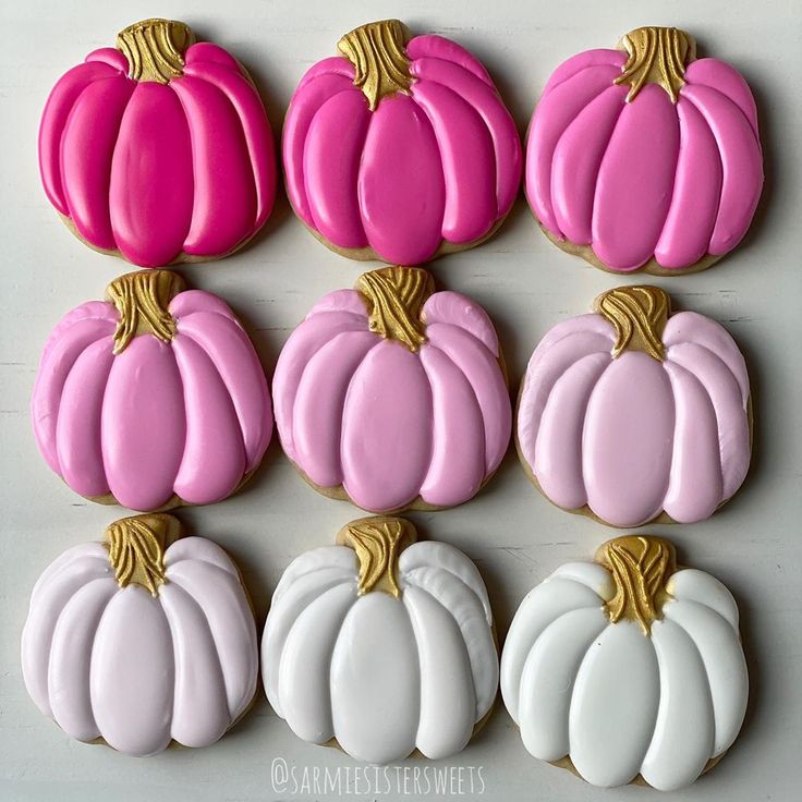 Whimsical Pumpkin-Shaped Cookies: A Charming Autumn Delight in Pink and White.