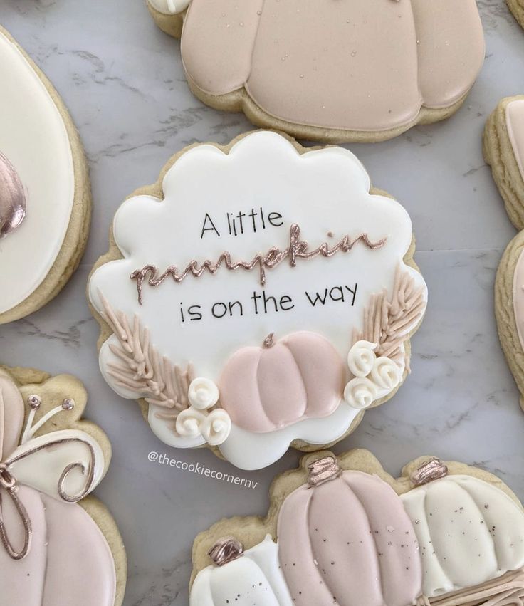 Charming Pastel Sugar Cookies with Whimsical Autumn Designs and Floral Accents.