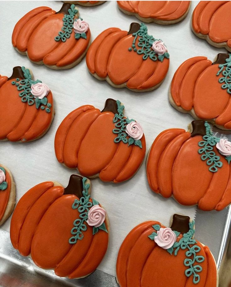 Festive Pumpkin-Shaped Cookies with Elegant Floral Accents for Autumn Celebrations