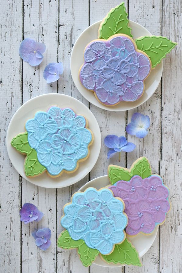 Delicate Floral-Themed Cookies with Intricate Icing in Soft Pastel Colors.