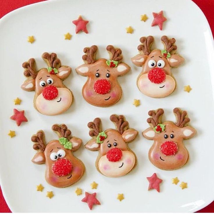 Festive Adorable Reindeer Cookies with Cheerful Designs for Holiday Celebrations.